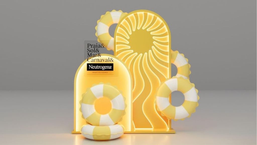 Exibição de uma ativação de marca em tons de amarelo vibrante e branco. O cenário inclui painéis iluminados com desenhos de sol, boias de praia listradas e o logotipo da Neutrogena com a frase "Praia & Sol & Mar & Carnaval". A imagem demonstra um photopoint estratégico para ações de marketing de carnaval.